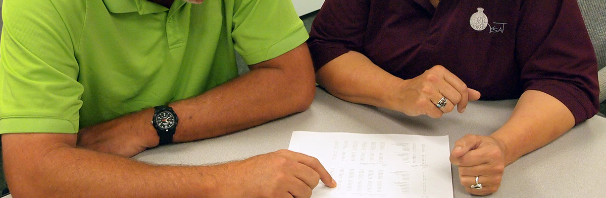 Two operators reviewing results.