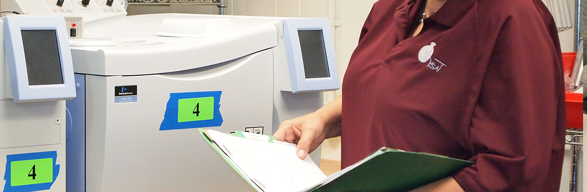 An operator using a manual.